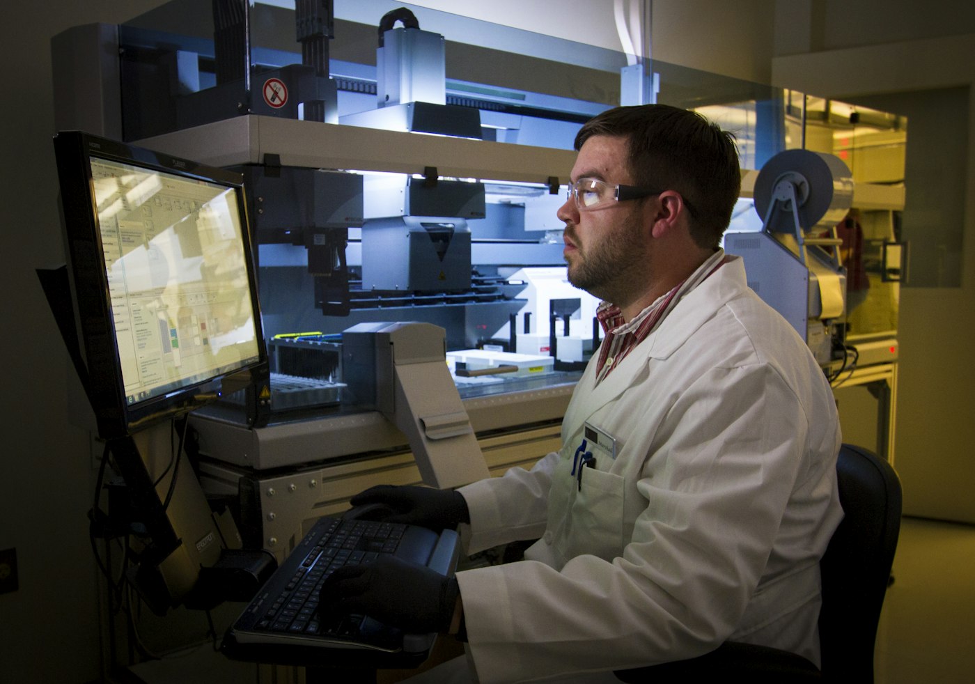 Scientist analysing data at a laboratory workstation