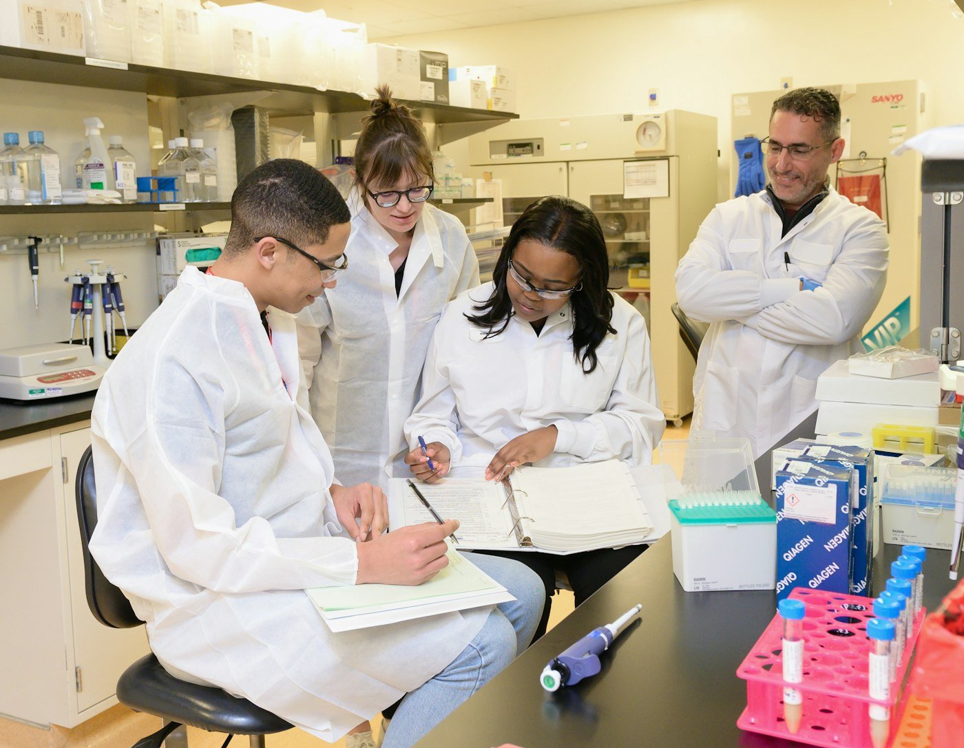 Scientists taking notes during a laboratory training session